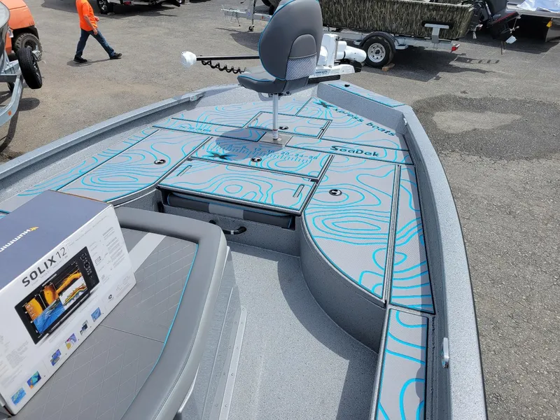 Slide: The Image of 2024 Xpress X23 Bay Lounge with dual Yamaha 150s, featuring SeaDek flooring and Solix 12 fish finder. - 5