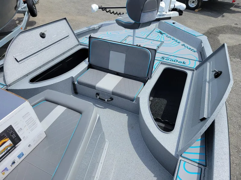 Slide: The Image of 2024 Xpress X23 Bay Lounge with dual Yamaha 150s, featuring spacious seating and storage compartments. - 6