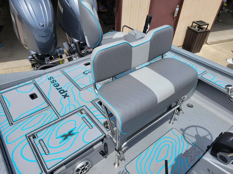 Slide: The Image of 2024 Xpress X23 Bay Lounge with dual Yamaha 150 engines, featuring stylish seating and deck design. - 8
