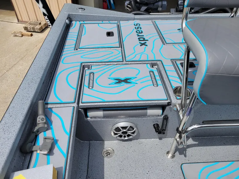 Slide: The Image of 2024 Xpress X23 Bay Lounge with dual Yamaha 150s, featuring stylish deck design and seating. - 9