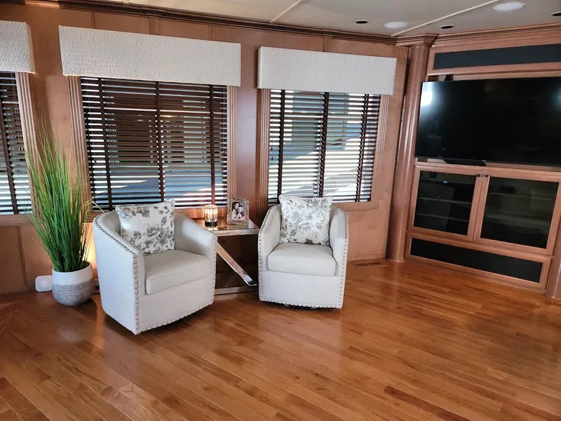 Slide: The Image of Luxurious 2008 Sumerset Houseboat interior with cozy seating area and large TV. - 10