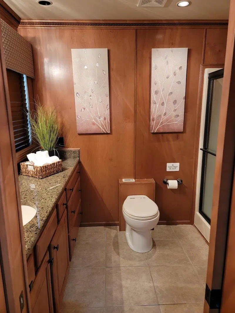 Slide: The Image of Luxurious bathroom in a 2008 Sumerset Houseboat with modern decor and granite countertops. - 17
