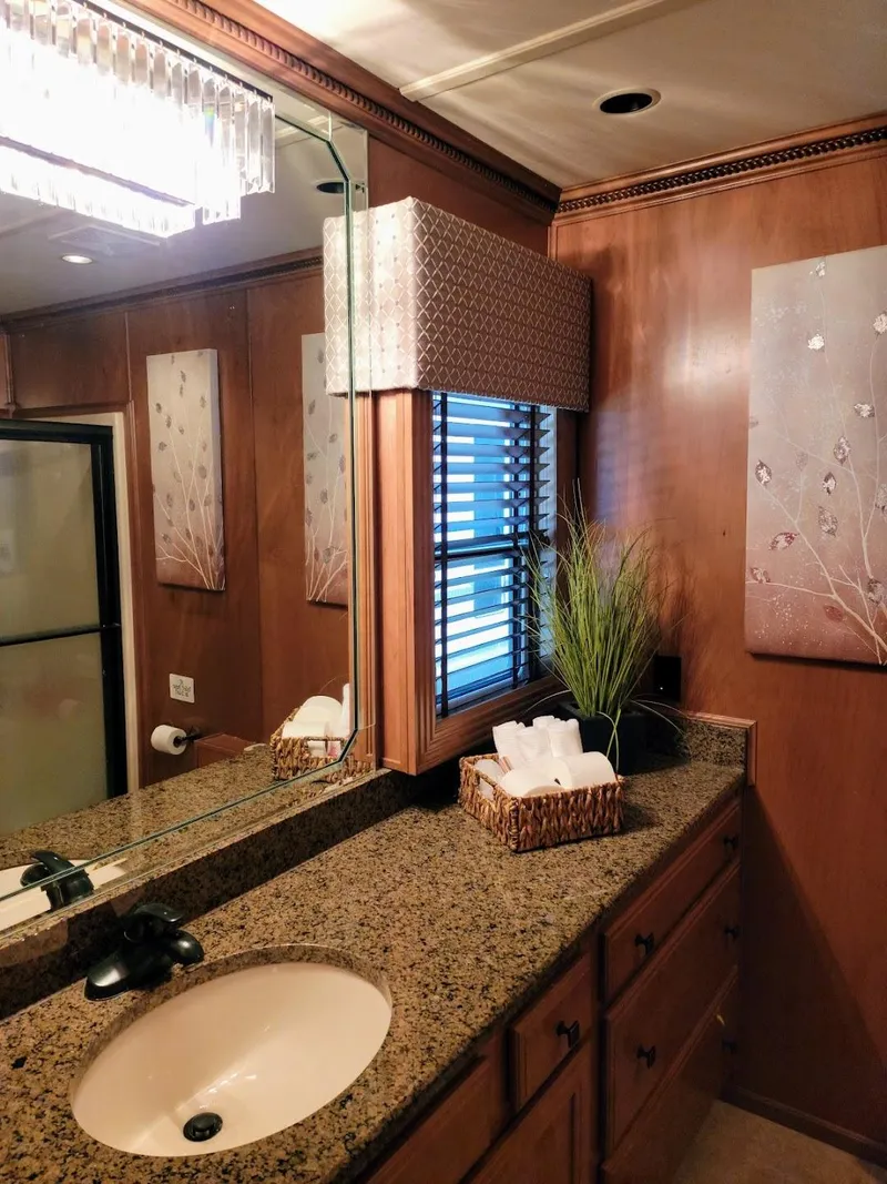 Slide: The Image of 2008 Sumerset Houseboat bathroom with granite countertop and wooden cabinets - 19