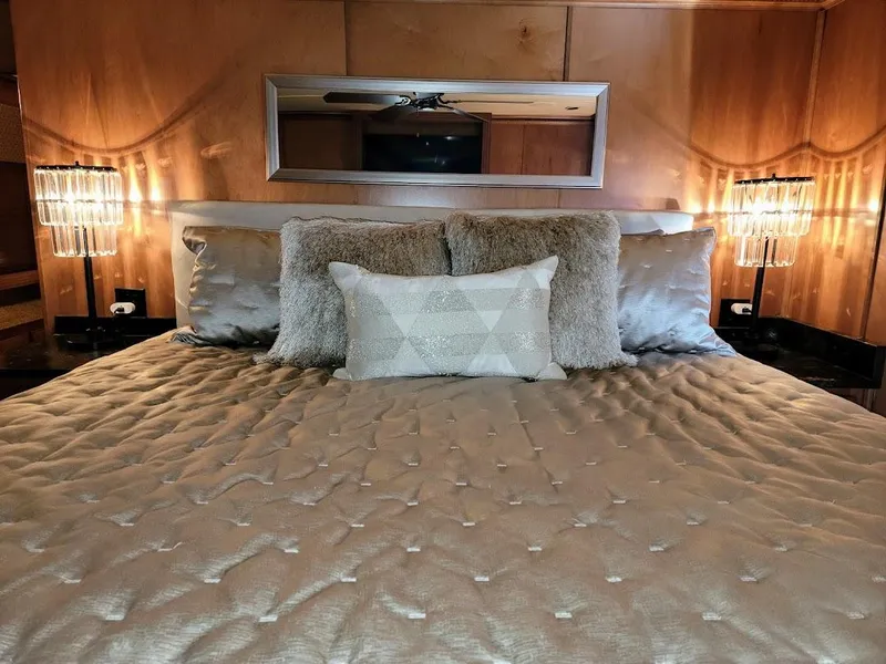 Slide: The Image of Luxurious bedroom interior of a 2008 Sumerset Houseboat with plush bedding and ambient lighting. - 28