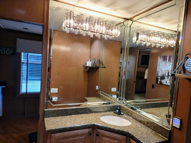 Slide: The Image of 2008 Sumerset Houseboat bathroom with granite countertop and mirrored walls. - 29