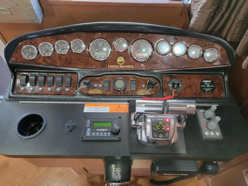 Slide: The Image of Control panel of a 2008 Sumerset Houseboat with gauges and switches. - 3