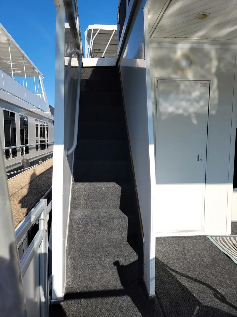 Slide: The Image of Staircase on a 2008 Sumerset Houseboat leading to the upper deck. - 41