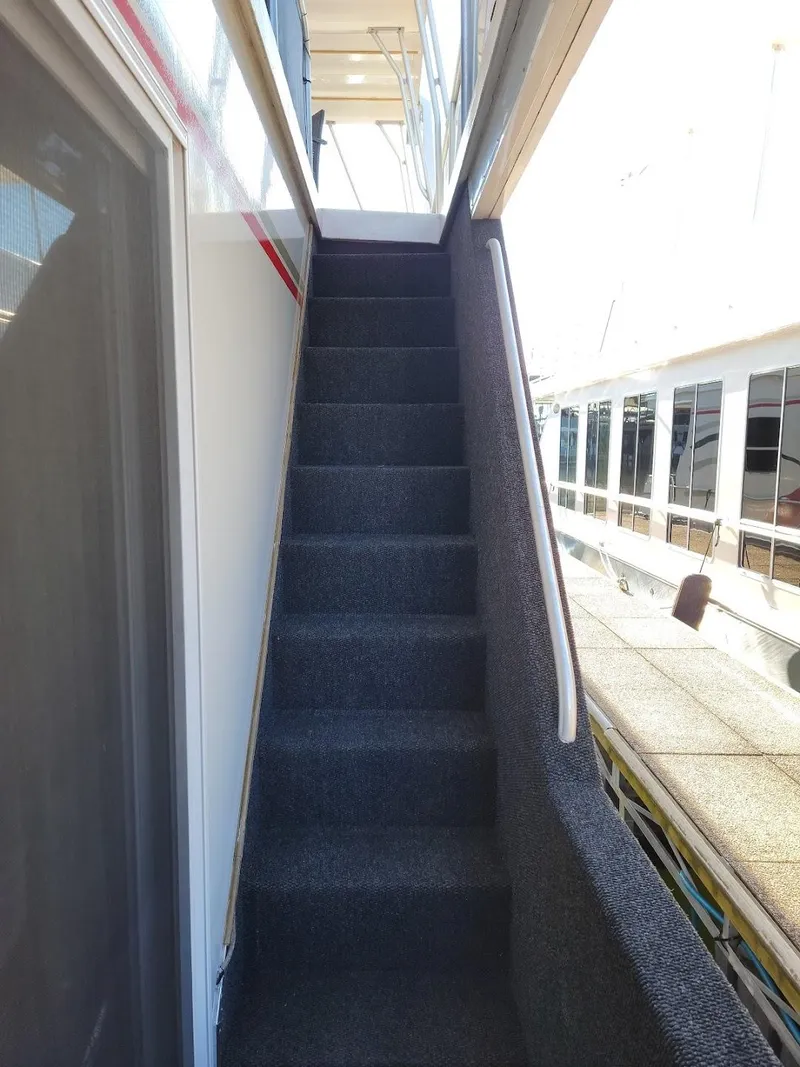 Slide: The Image of Staircase on a 2008 Sumerset Houseboat leading to the upper deck. - 44
