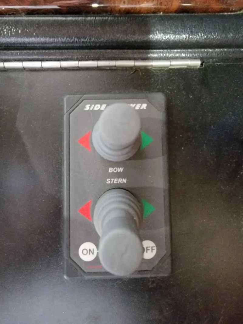 Slide: The Image of Control panel of a 2008 Sumerset Houseboat with bow and stern thruster joysticks. - 6
