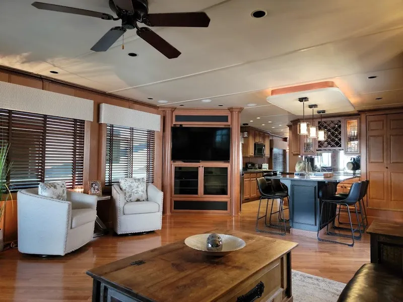 Slide: The Image of Luxurious interior of a 2008 Sumerset Houseboat with modern furnishings and open kitchen. - 8