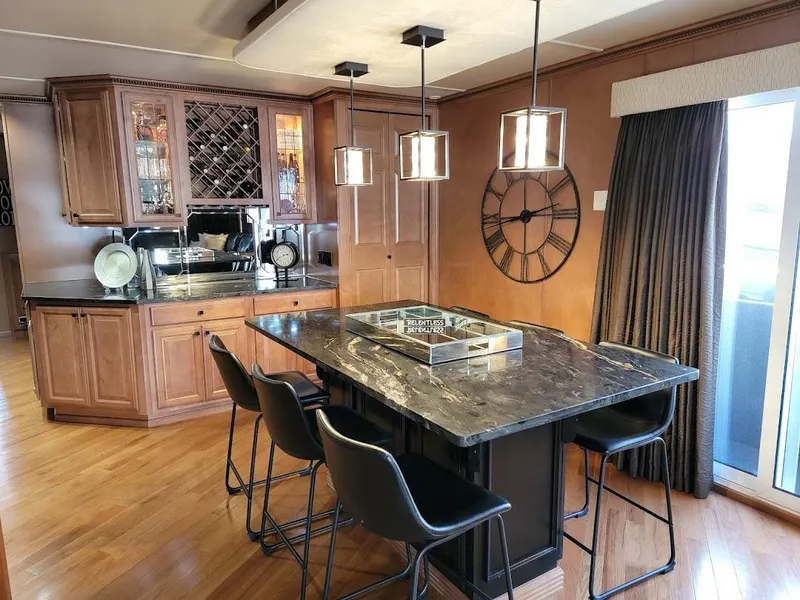 Slide: The Image of Luxurious 2008 Sumerset Houseboat interior with modern kitchen and dining area. - 9