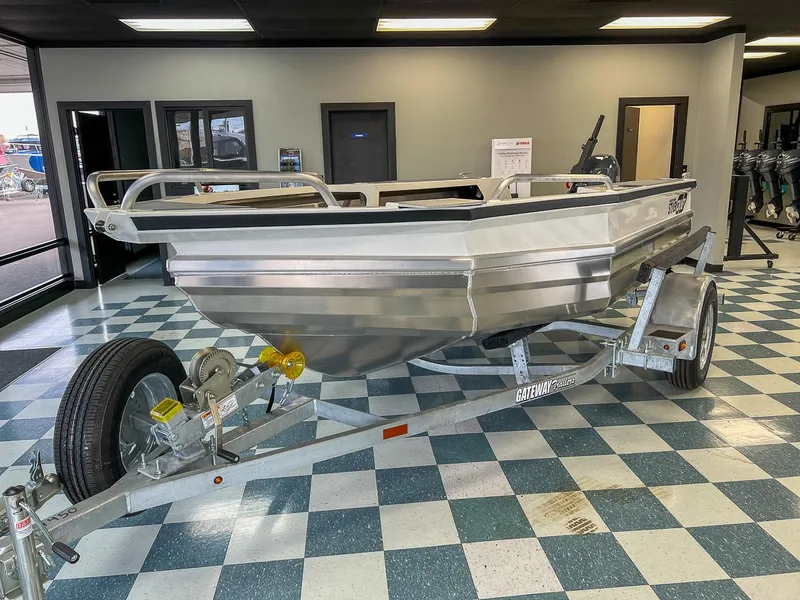 Slide: The Image of 2025 Stabicraft 1450 Explorer boat on trailer in showroom. - 3