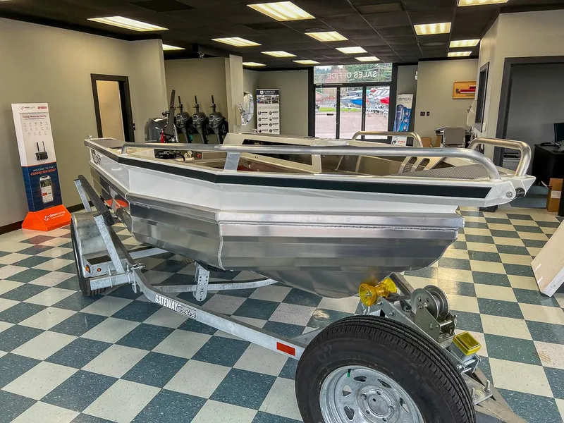 Slide: The Image of 2025 Stabicraft 1450 Explorer boat on trailer in showroom. - 4