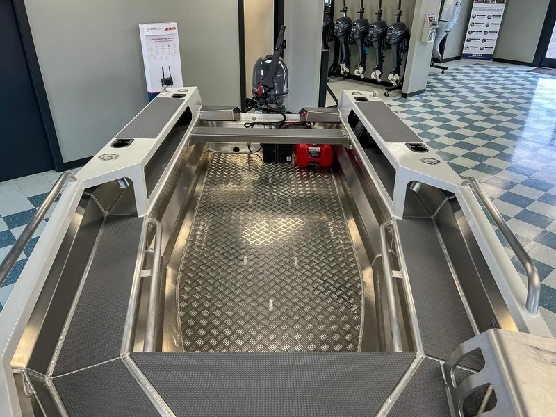 Slide: The Image of 2025 Stabicraft 1450 Explorer boat interior with aluminum flooring and storage compartments. - 5