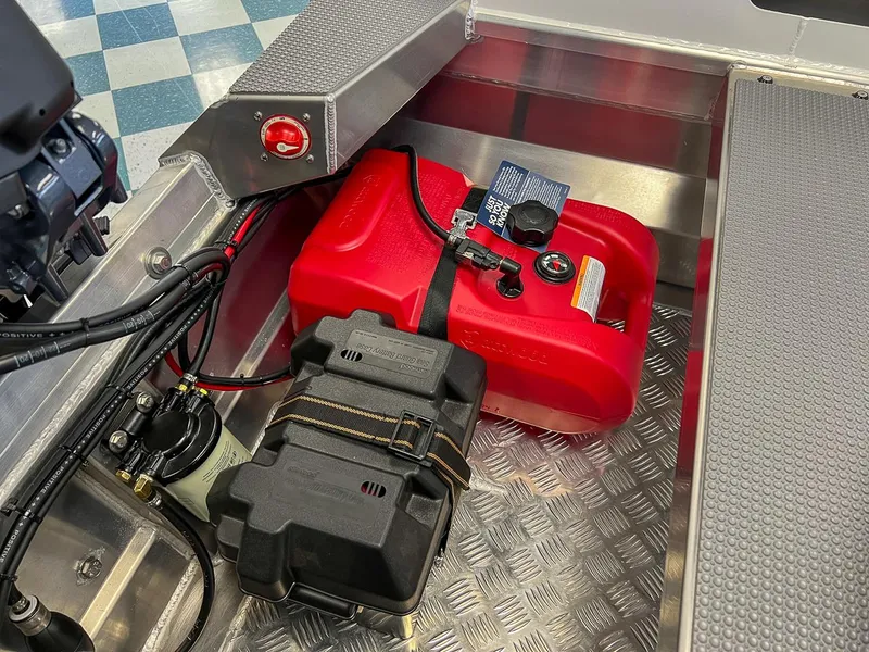 Slide: The Image of Stabicraft 1450 Explorer 2025 boat interior showing fuel tank and battery compartment. - 7
