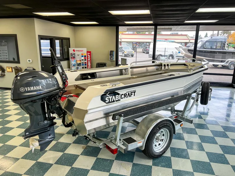 Slide: The Image of 2025 Stabicraft 1450 Explorer boat with Yamaha outboard motor in showroom. - 8