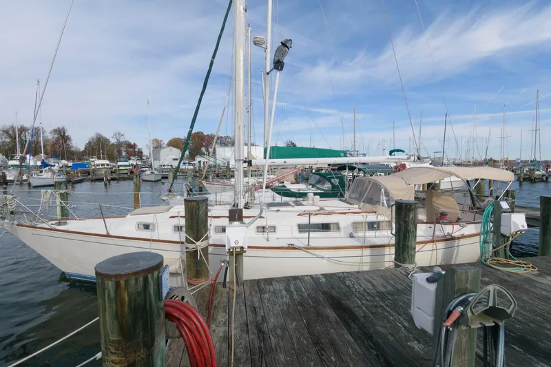 The Image of 1984 Sabre 38 MK I sailboat docked at a marina with clear skies. - 0