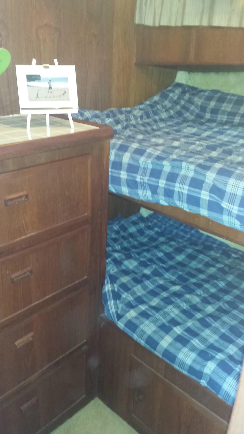 Slide: The Image of 1975 Uniflite Aft Cabin interior with bunk beds. - 13