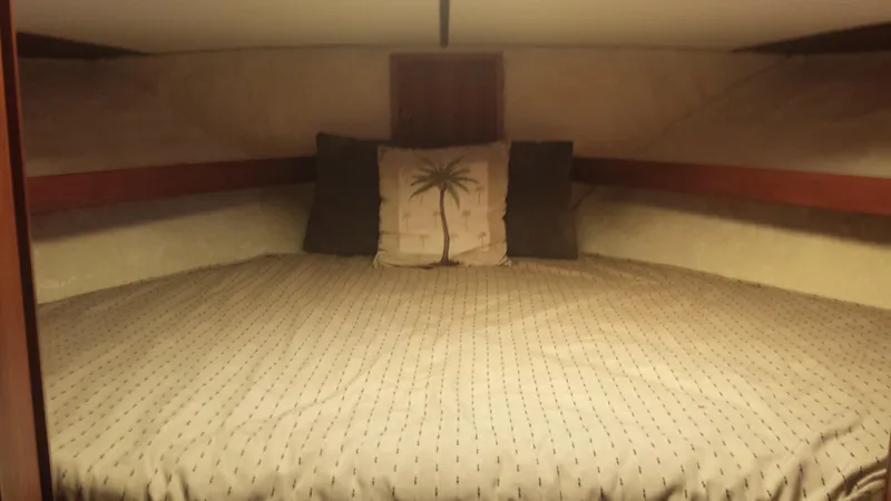 Slide: The Image of Interior of a 1975 Uniflite Aft Cabin with cozy bed. - 14