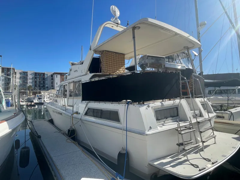 Slide: The Image of 1975 Uniflite Aft Cabin yacht docked at marina. - 2