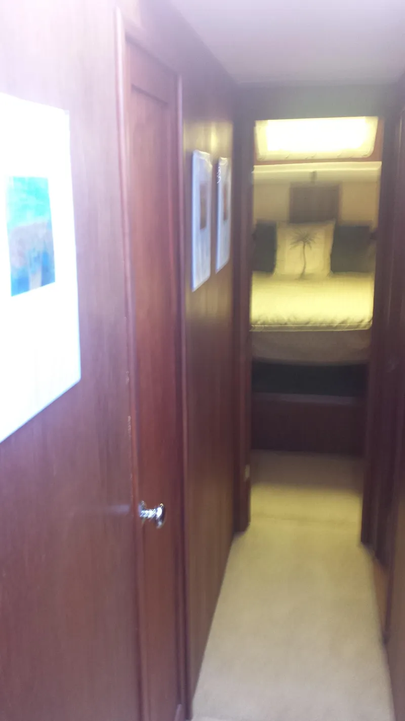 Slide: The Image of Interior of a 1975 Uniflite Aft Cabin yacht with wooden walls. - 22