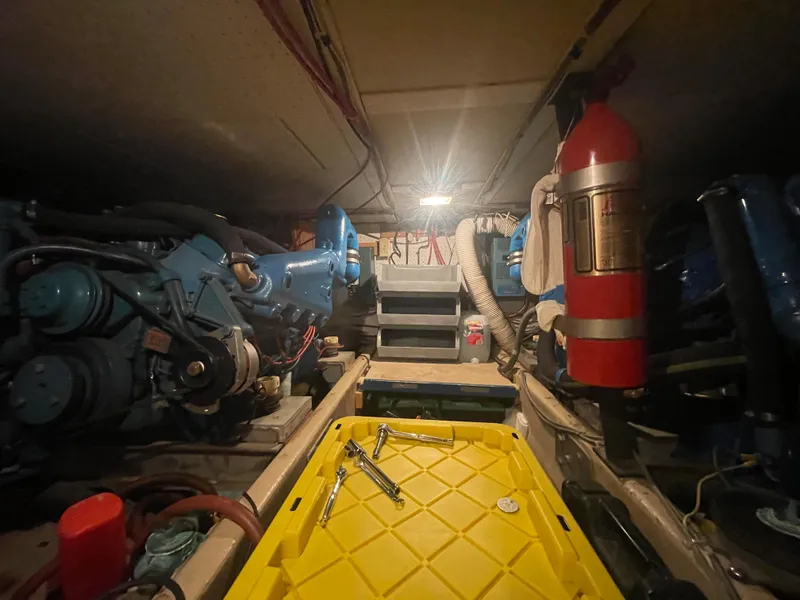 Slide: The Image of Engine room of a 1975 Uniflite Aft Cabin boat with tools. - 27