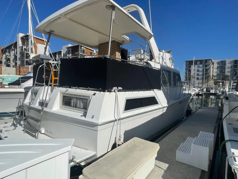 Slide: The Image of 1975 Uniflite Aft Cabin yacht docked at marina. - 3