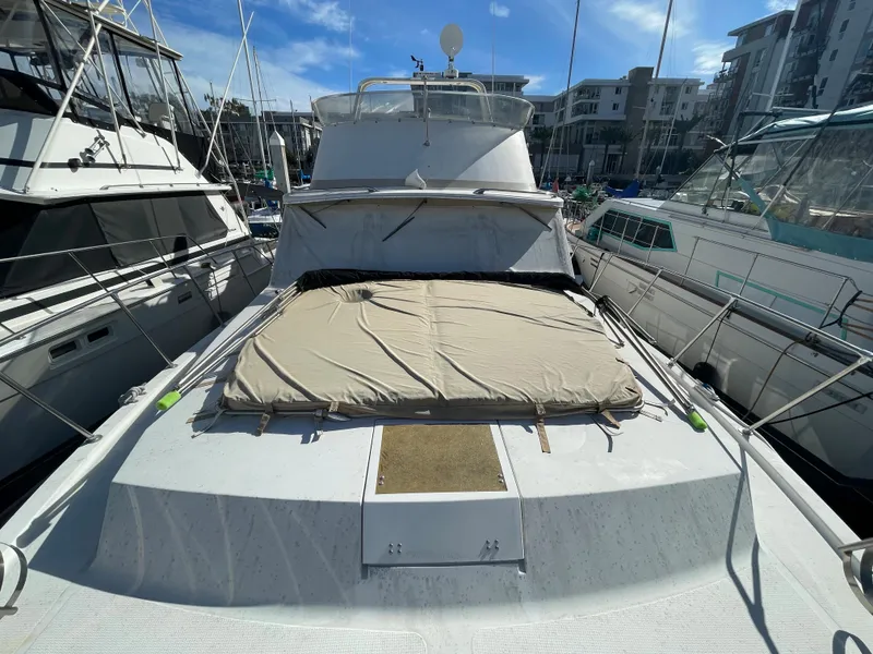 Slide: The Image of 1975 Uniflite Aft Cabin yacht docked, front view. - 30