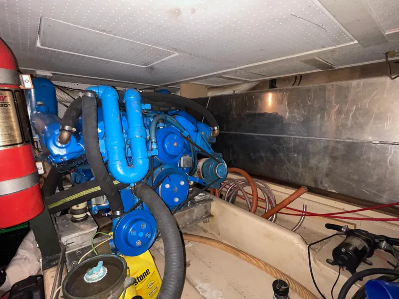 Slide: The Image of Engine room of a 1975 Uniflite Aft Cabin boat with blue engine. - 35