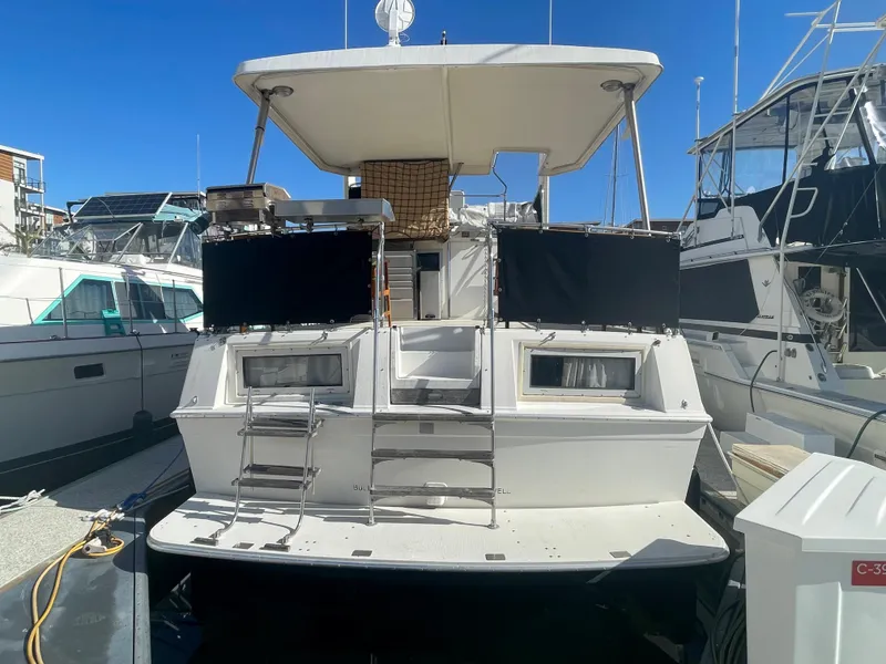 Slide: The Image of 1975 Uniflite Aft Cabin boat docked at marina. - 4