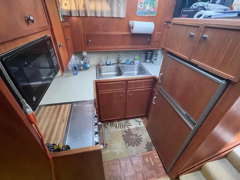 Slide: The Image of Compact kitchen in a 1975 Uniflite Aft Cabin yacht. - 40