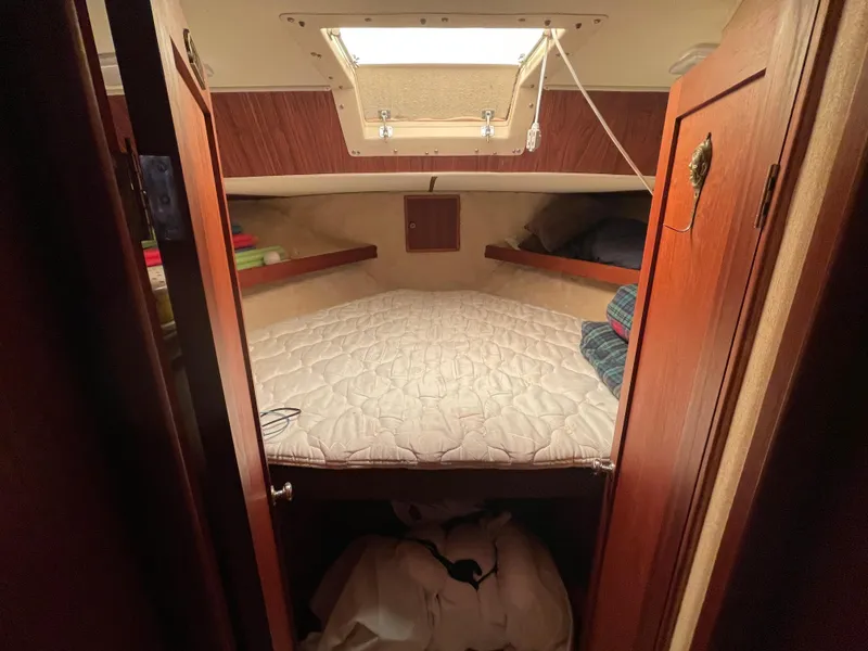 Slide: The Image of Interior of a 1975 Uniflite Aft Cabin with cozy bed. - 45