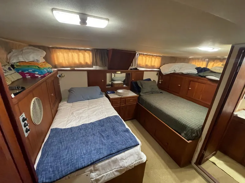 Slide: The Image of Interior of a 1975 Uniflite Aft Cabin with two beds. - 47