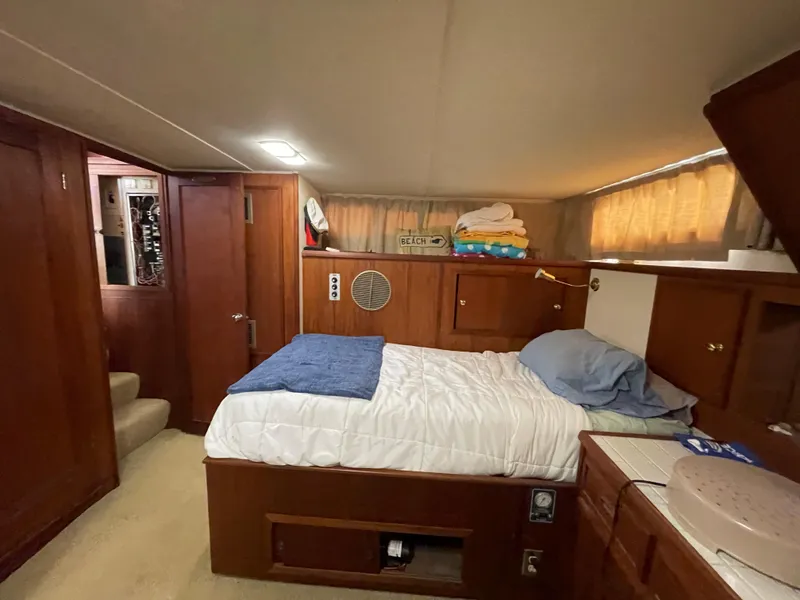 Slide: The Image of Interior of a 1975 Uniflite Aft Cabin featuring a cozy bedroom. - 49