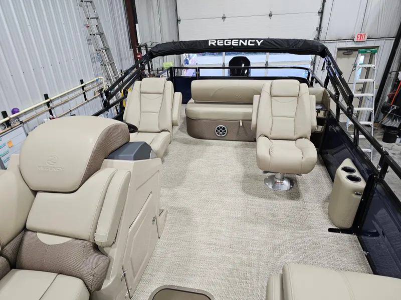 Slide: The Image of 2024 Regency 250 DL3 pontoon boat interior with luxurious seating and modern design. - 5