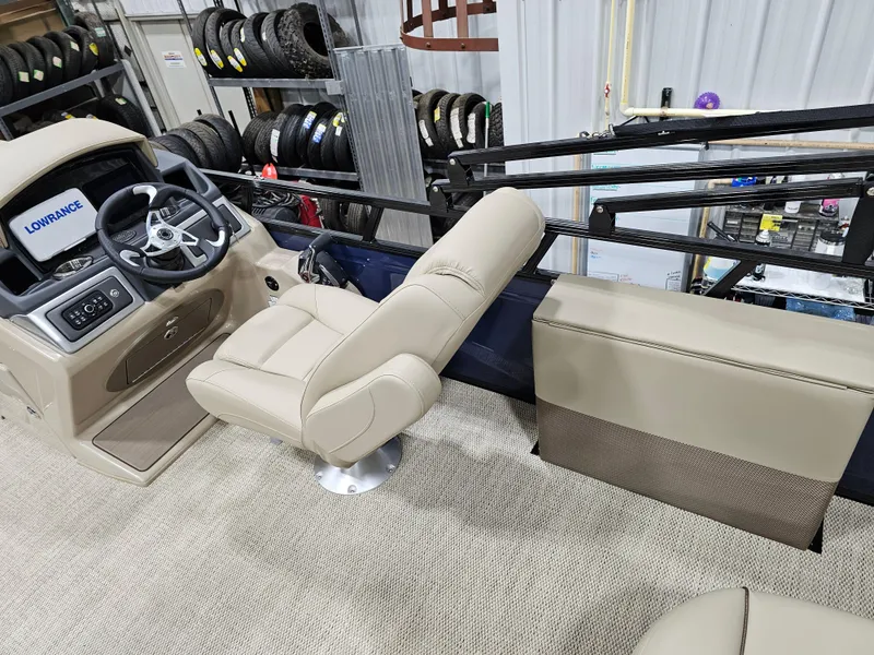Slide: The Image of 2024 Regency 250 DL3 boat interior with beige captain's chair and steering console. - 8