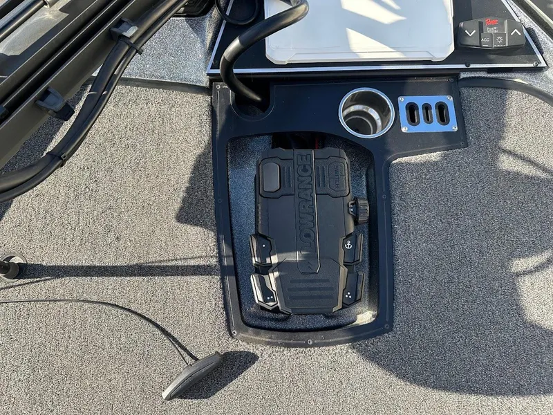 Slide: The Image of 2024 Ranger Z520R boat console with cup holder and control panel. - 22