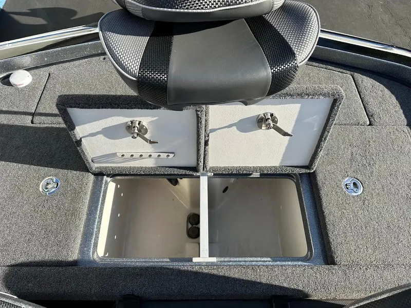 Slide: The Image of 2024 Ranger Z520R boat storage compartments with secure locks and seating. - 25
