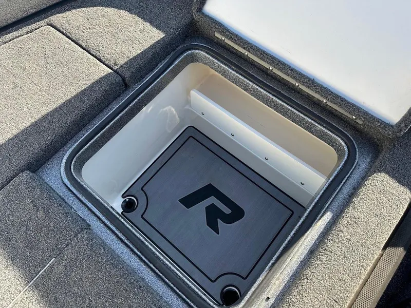 Slide: The Image of 2024 Ranger Z520R storage compartment with logo, featuring durable interior design. - 27