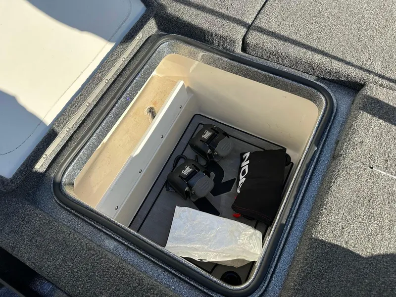 Slide: The Image of 2024 Ranger Z520R storage compartment with equipment and accessories. - 28