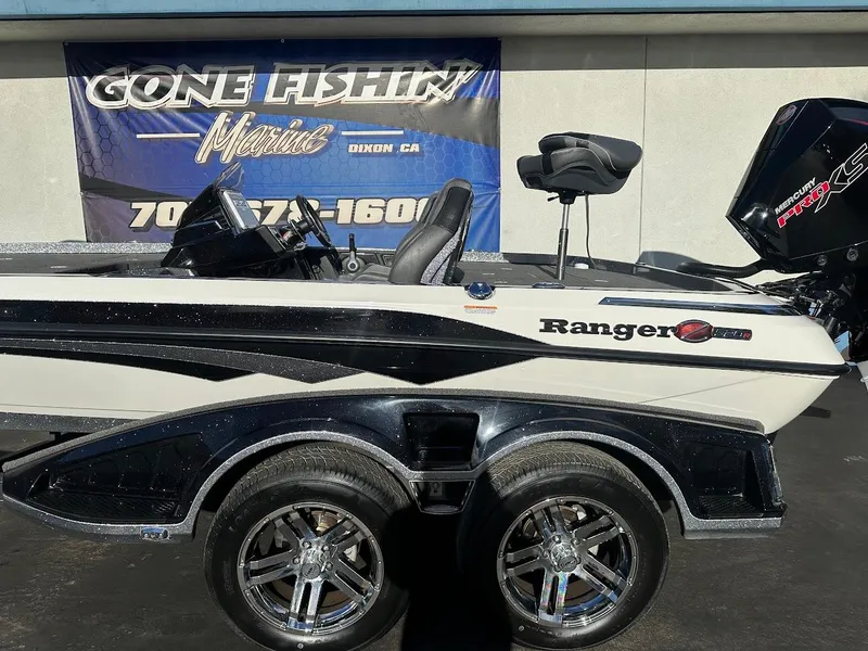 Slide: The Image of 2024 Ranger Z520R Ranger Cup Equipped boat with sleek design and dual wheels. - 6