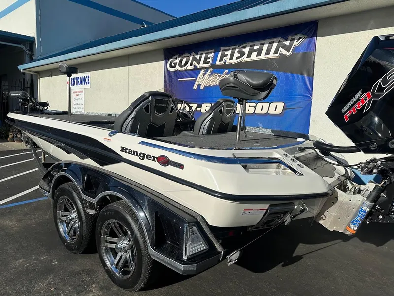 Slide: The Image of 2024 Ranger Z520R boat parked outside dealership, showcasing sleek design and dual seats. - 7