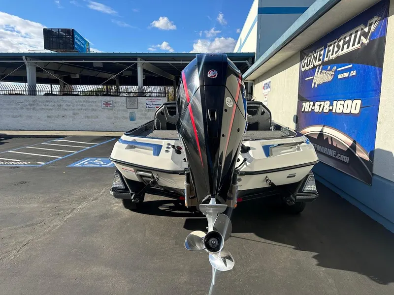 Slide: The Image of 2024 Ranger Z520R boat in parking lot, rear view with motor. - 9