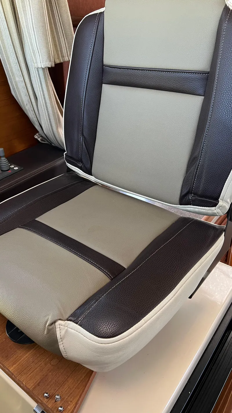 Slide: The Image of 2014 Ranger Tugs R29S boat seat with beige and brown upholstery. - 10