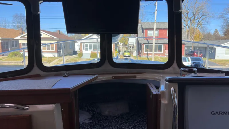 Slide: The Image of Interior view of 2014 Ranger Tugs R29S boat with windows and Garmin equipment. - 16