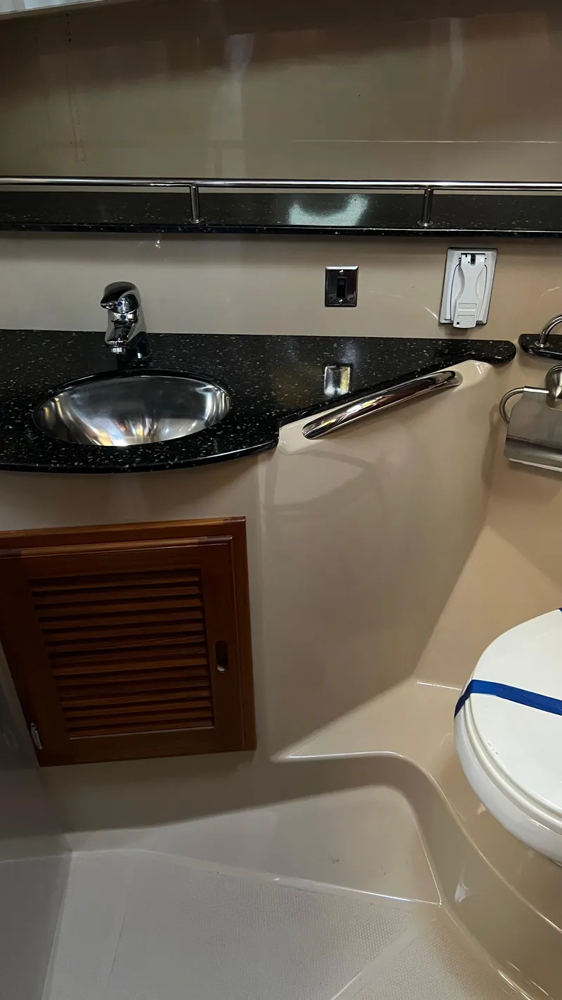 Slide: The Image of 2014 Ranger Tugs R29S bathroom with sink, countertop, and toilet. - 20
