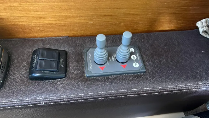 Slide: The Image of 2014 Ranger Tugs R29S control panel with joysticks and switches. - 24