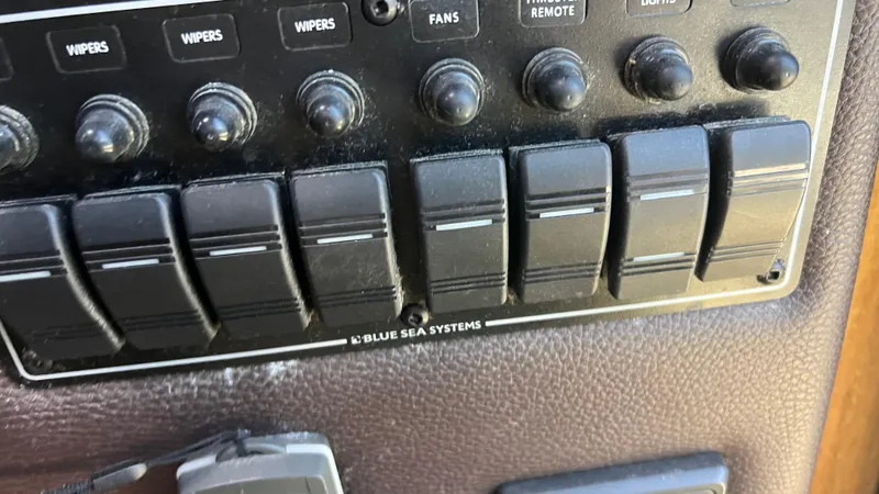 Slide: The Image of Control panel of a 2014 Ranger Tugs R29S boat with Blue Sea Systems switches. - 27