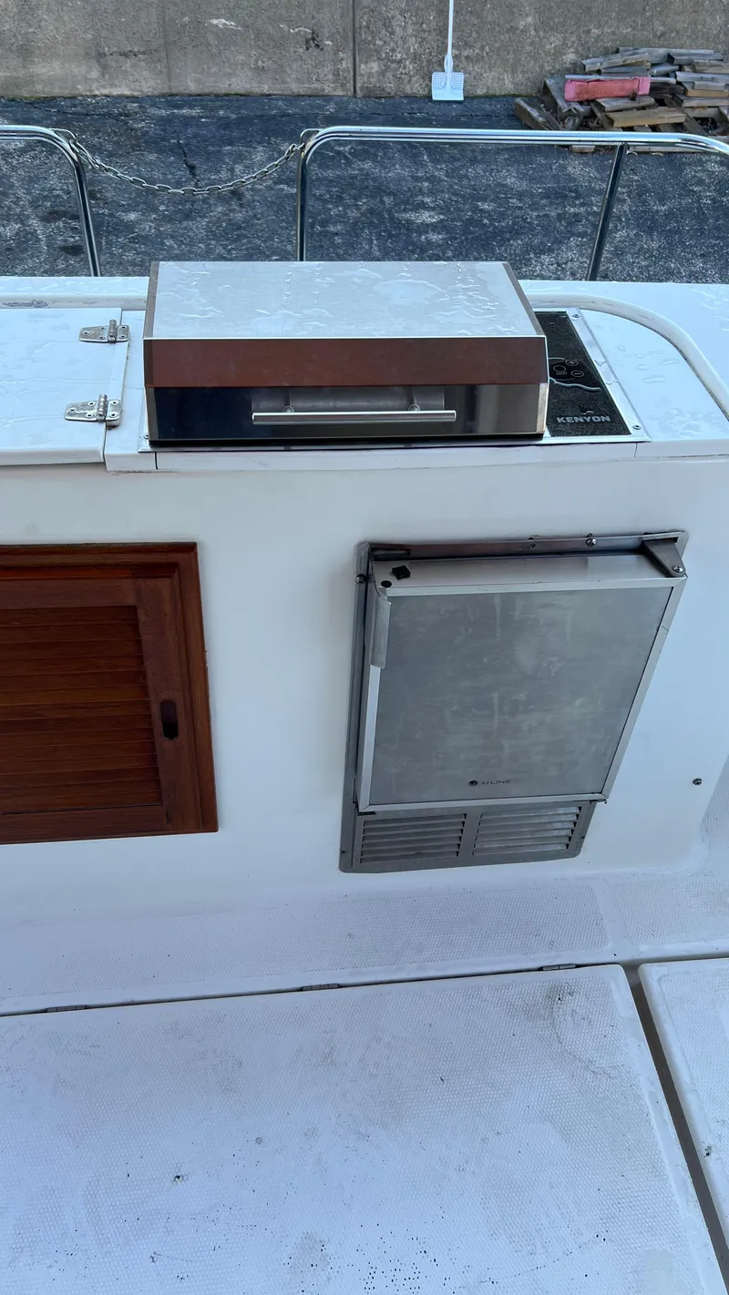Slide: The Image of 2014 Ranger Tugs R29S boat deck with grill and storage compartments. - 34