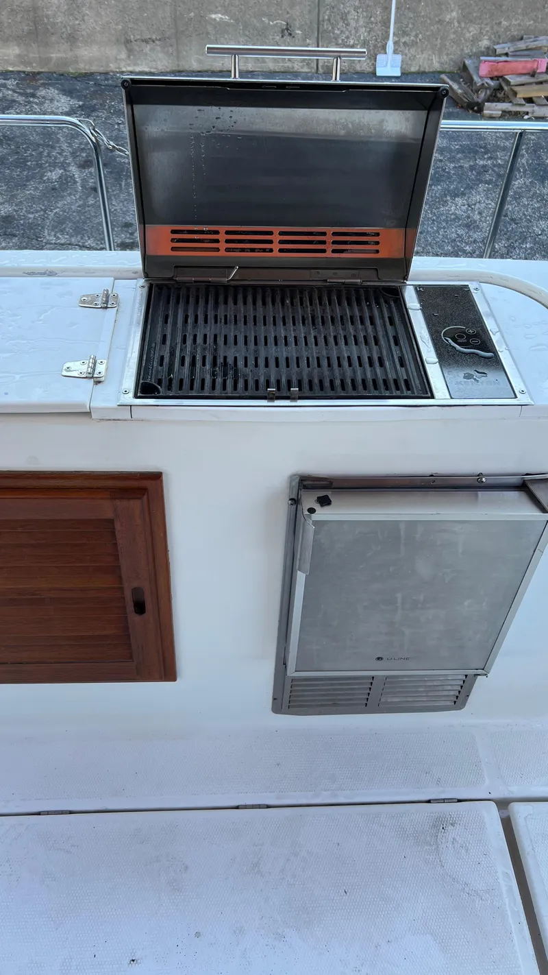 Slide: The Image of Outdoor grill and storage on 2014 Ranger Tugs R29S boat deck. - 35